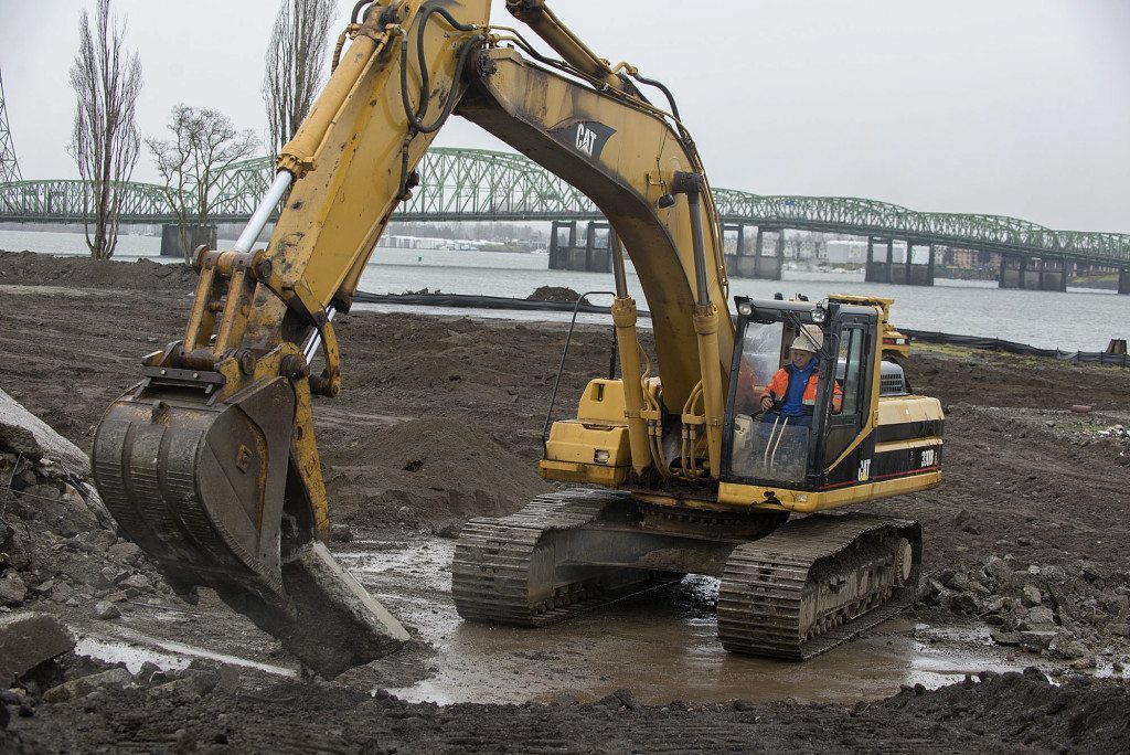 Stewart Brewer of Robertson & Olson Construction lends a hand to the development of the Vancouver waterfront area Wednesday morning, March 9, 2016. (Amanda Cowan/The Columbian)